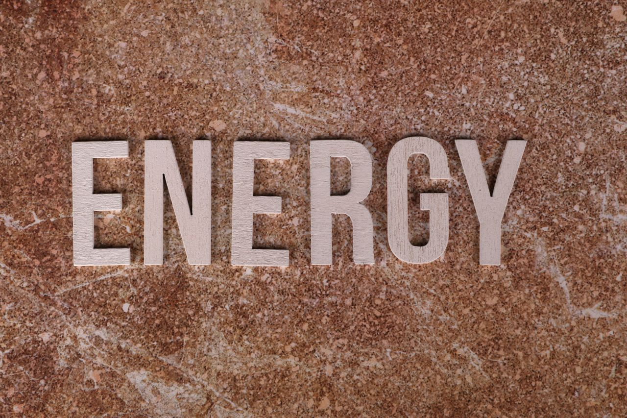 Crafting Captivating Headlines: Your awesome post title goes here Word Energy on natural stone texture, symbolizing raw power.